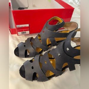 Kickers sandals. Black, very cute with pants or skirts.